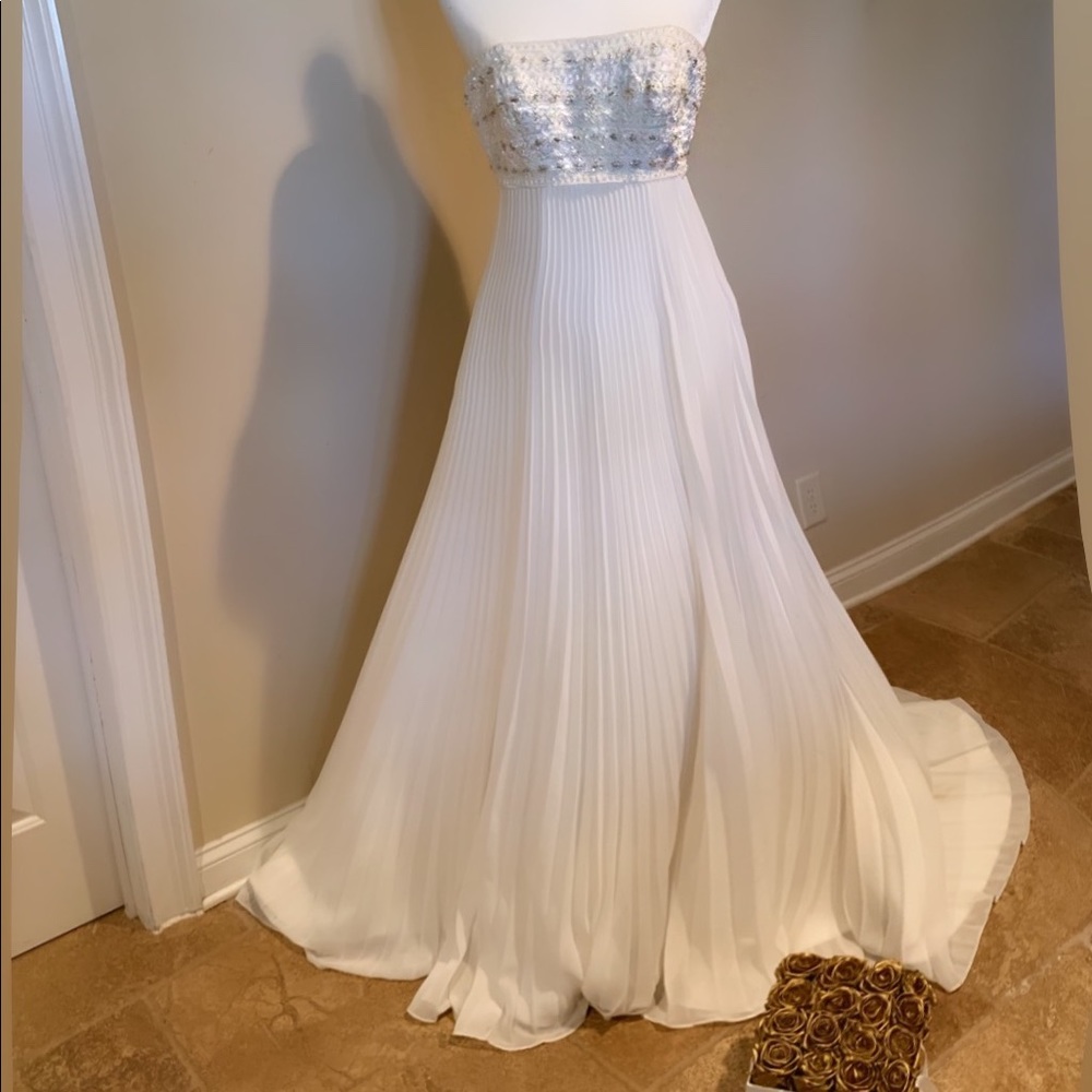 Size 4 fully beaded bodice wedding gown